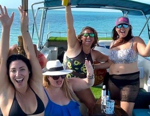 Boat rental with four women celebrating in Key West